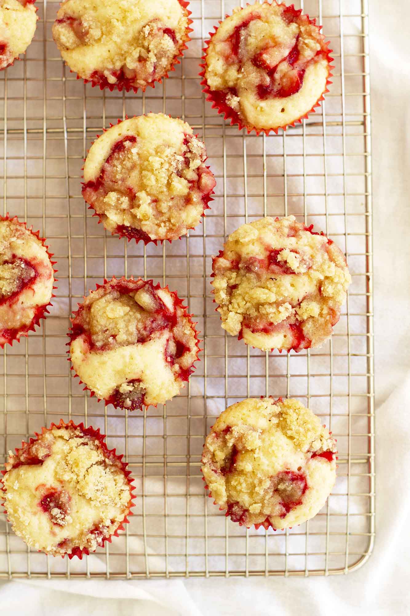 strawberry crumble muffins on cooling rack