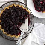 blackberry black bottom pie on cooling rack.