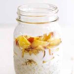 peaches and cream overnight oats in glass jar.