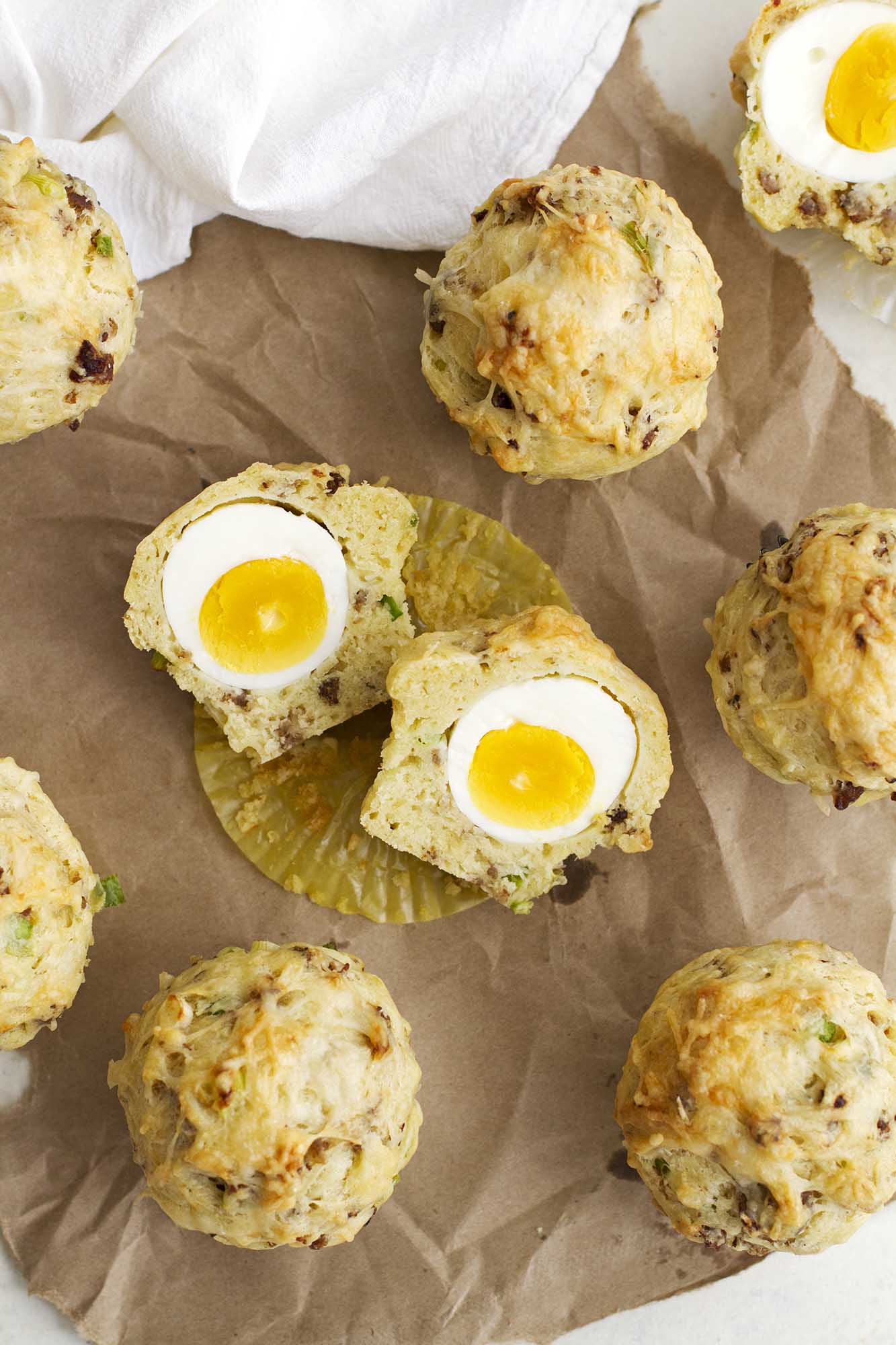 breakfast egg cheese muffins on parchment paper