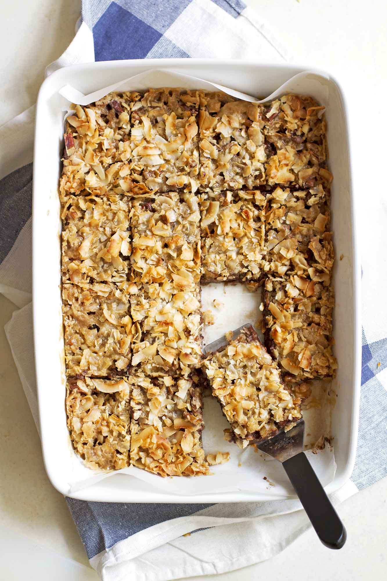 caramel coconut chocolate chip bars in baking dish