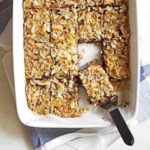 caramel coconut chocolate chip bars in baking dish.