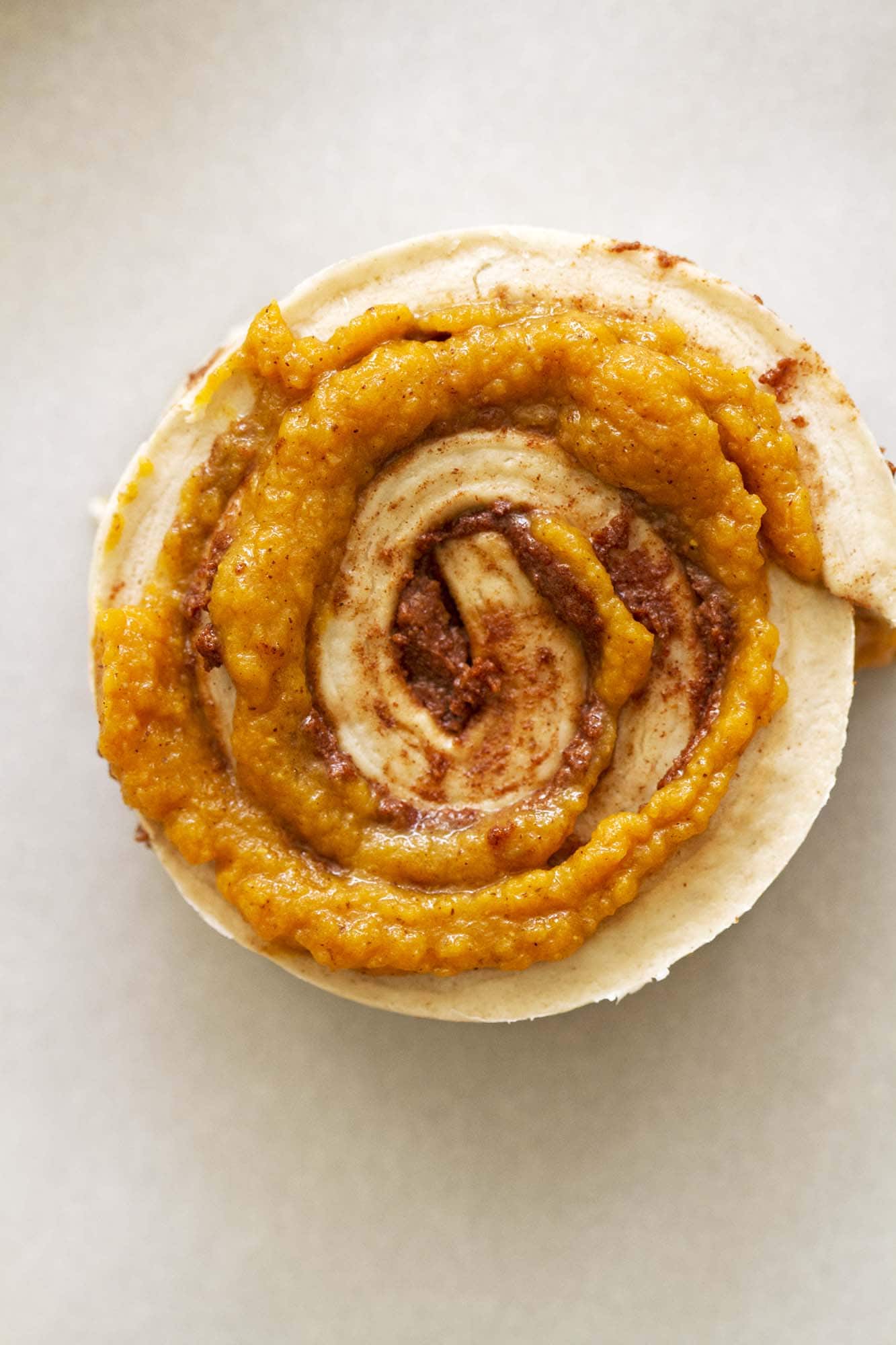 brown butter pumpkin cinnamon roll ready for baking