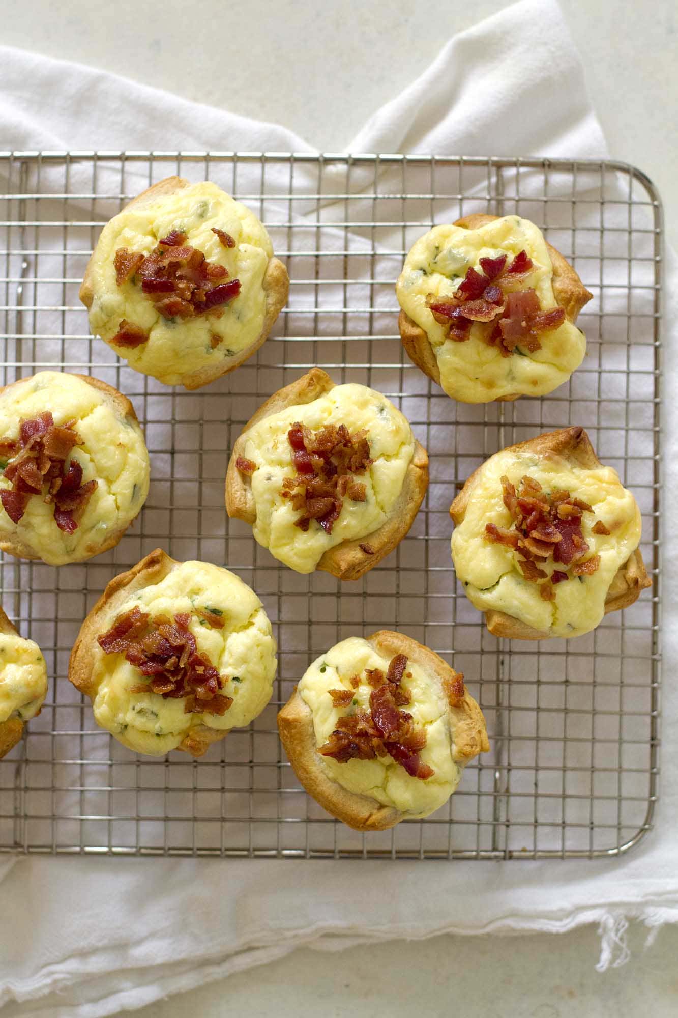 bacon quiche crescent cups on cooling rack
