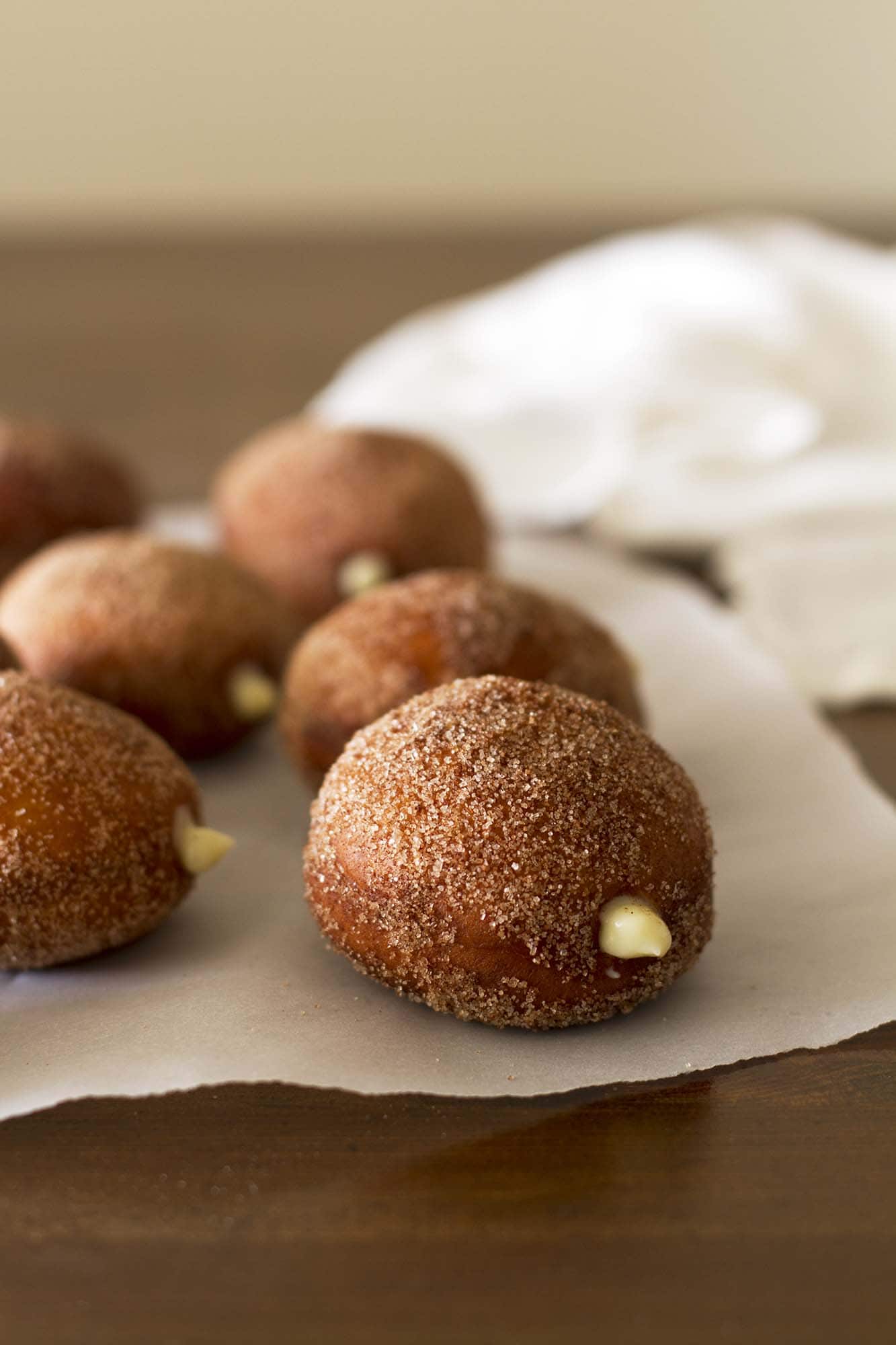 maple vanilla chai doughnuts on parchment paper