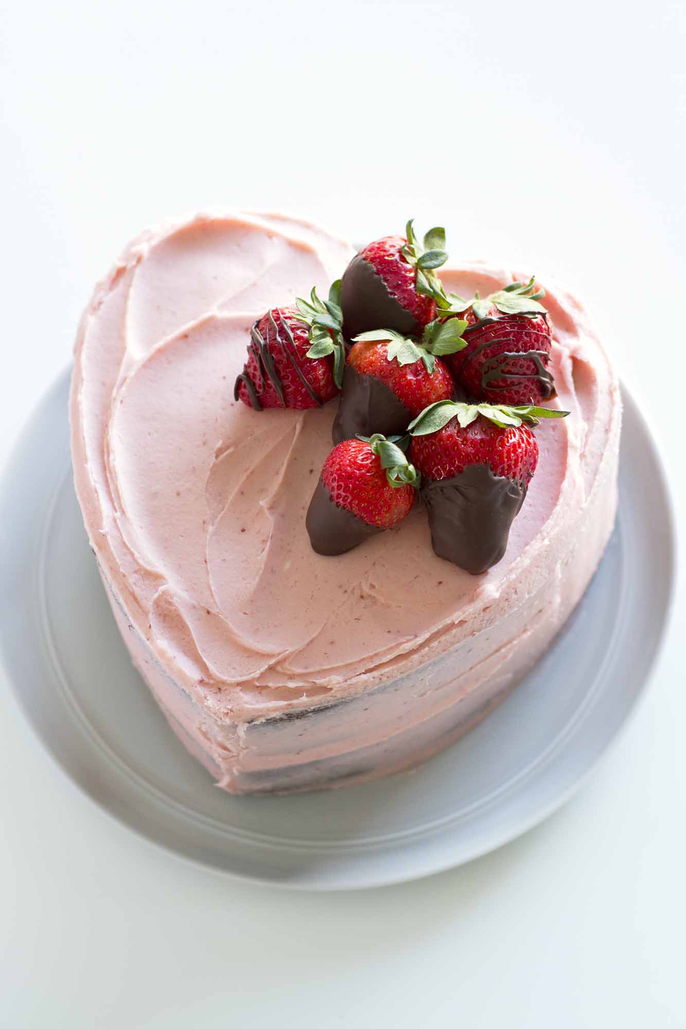 heart shaped chocolate strawberry cake on plate