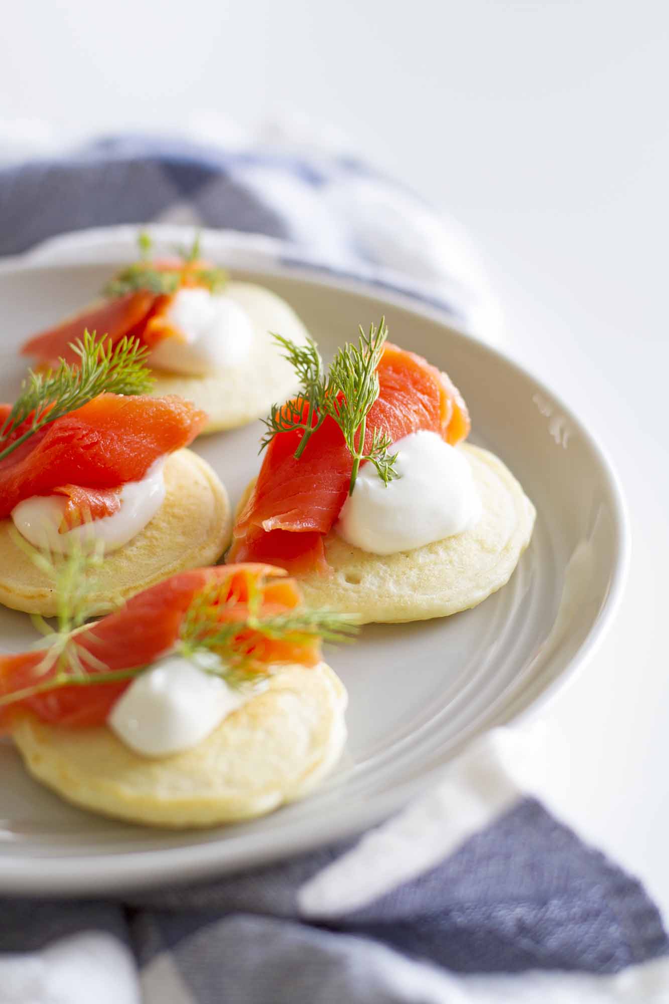 pancake blini with salmon and dill on plate