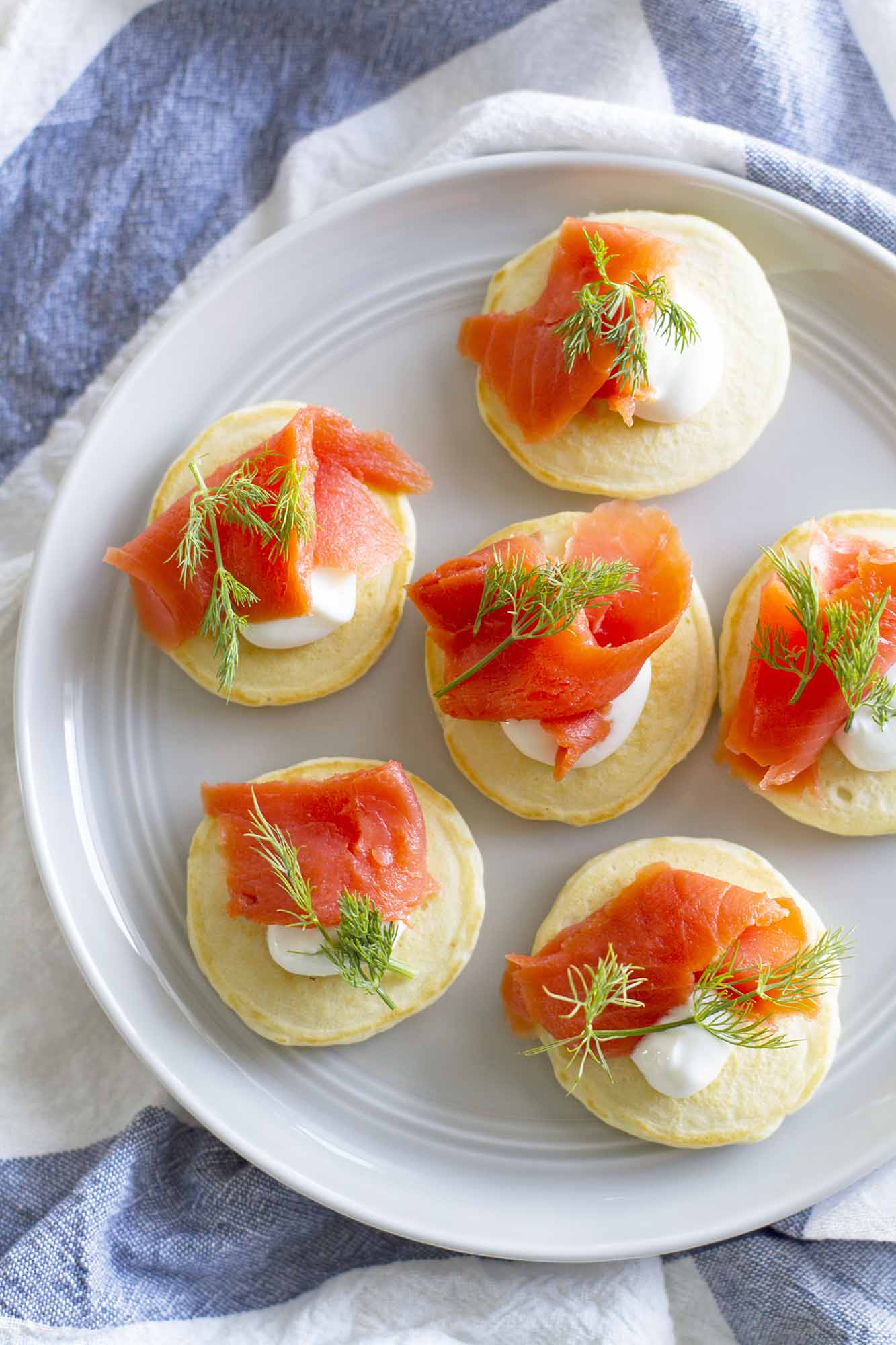 pancake blini with salmon and dill on plate