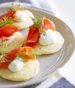pancake blini with salmon and dill on plate