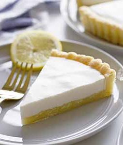 lemon buttermilk sugar cookie tart slice on plate