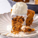 slice of skillet cookie with melting ice cream.