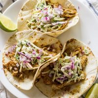 slow cooker green chile pork tacos on a plate
