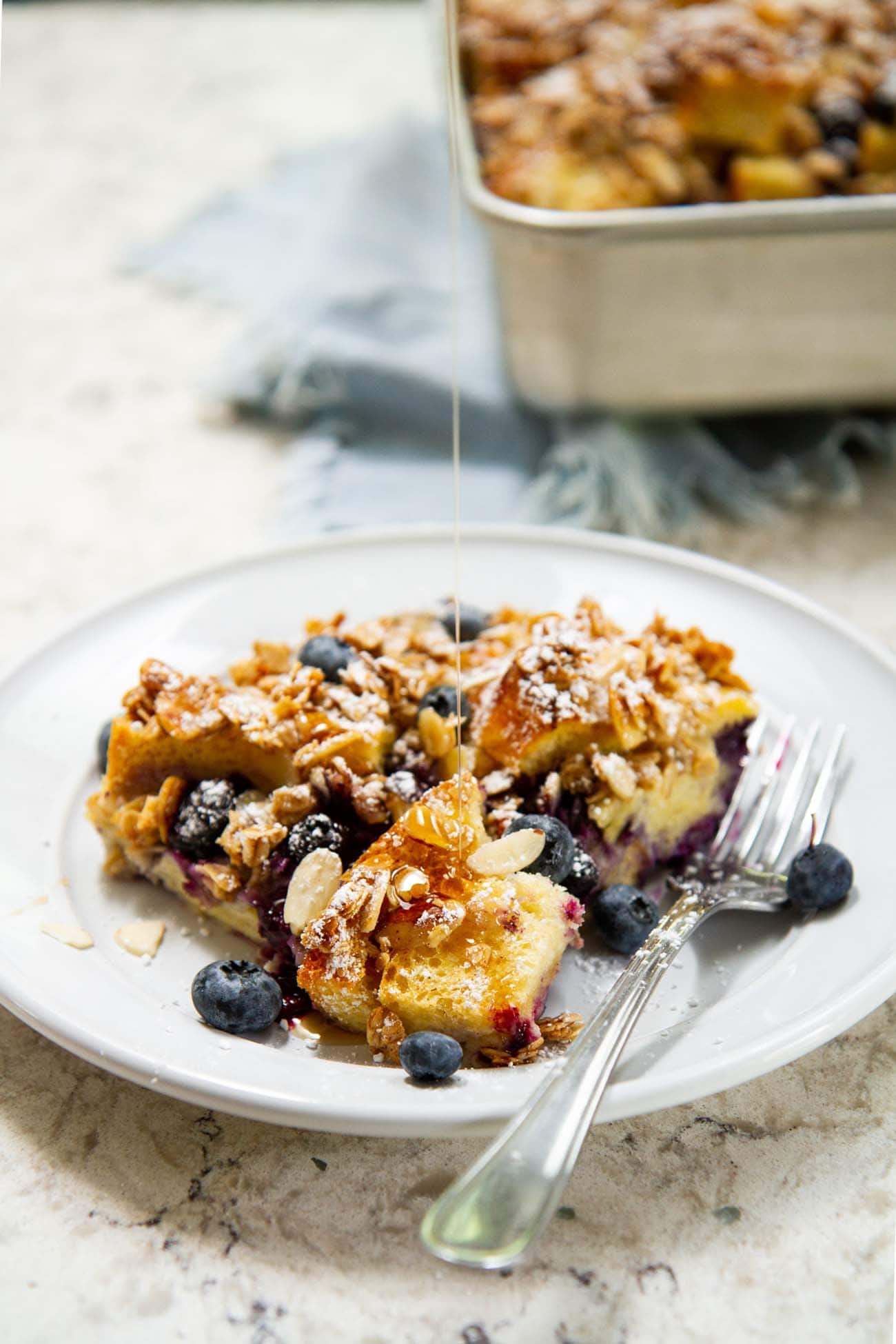 blueberry brioche french toast casserole on a plate