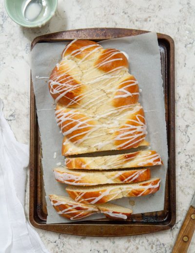 braided cardamom pulla bread on a baking sheet