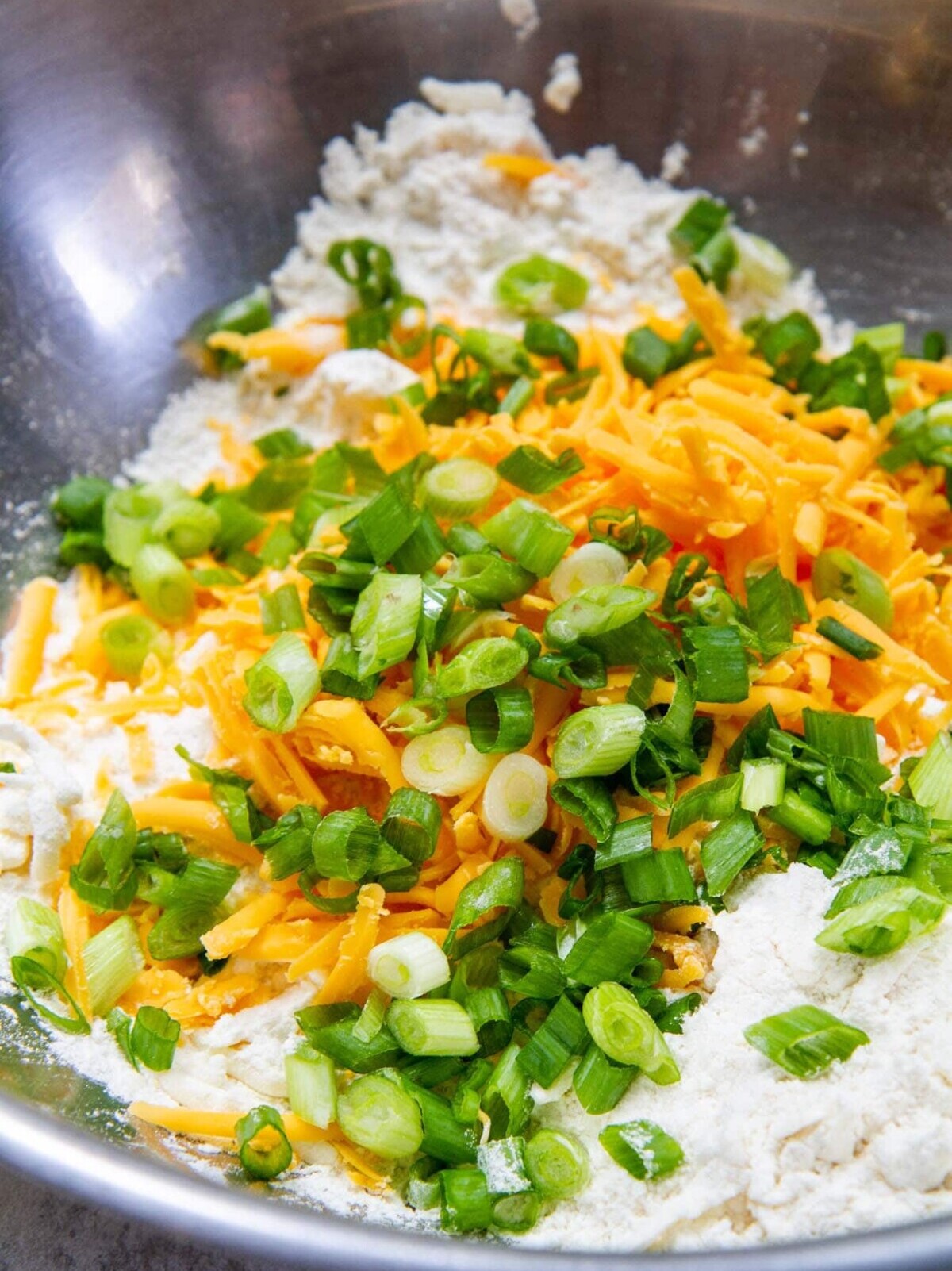 cheddar scallion biscuits ingredients in bowl