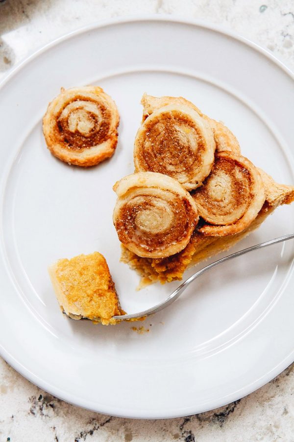 slice of cinnamon swirl pumpkin pie on a plate