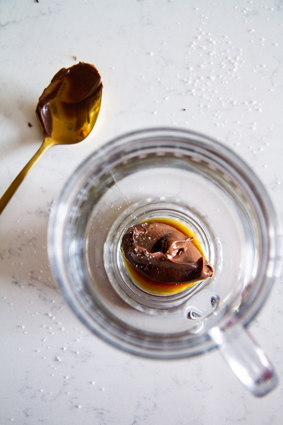 placing hazelnut spread in the glass mug