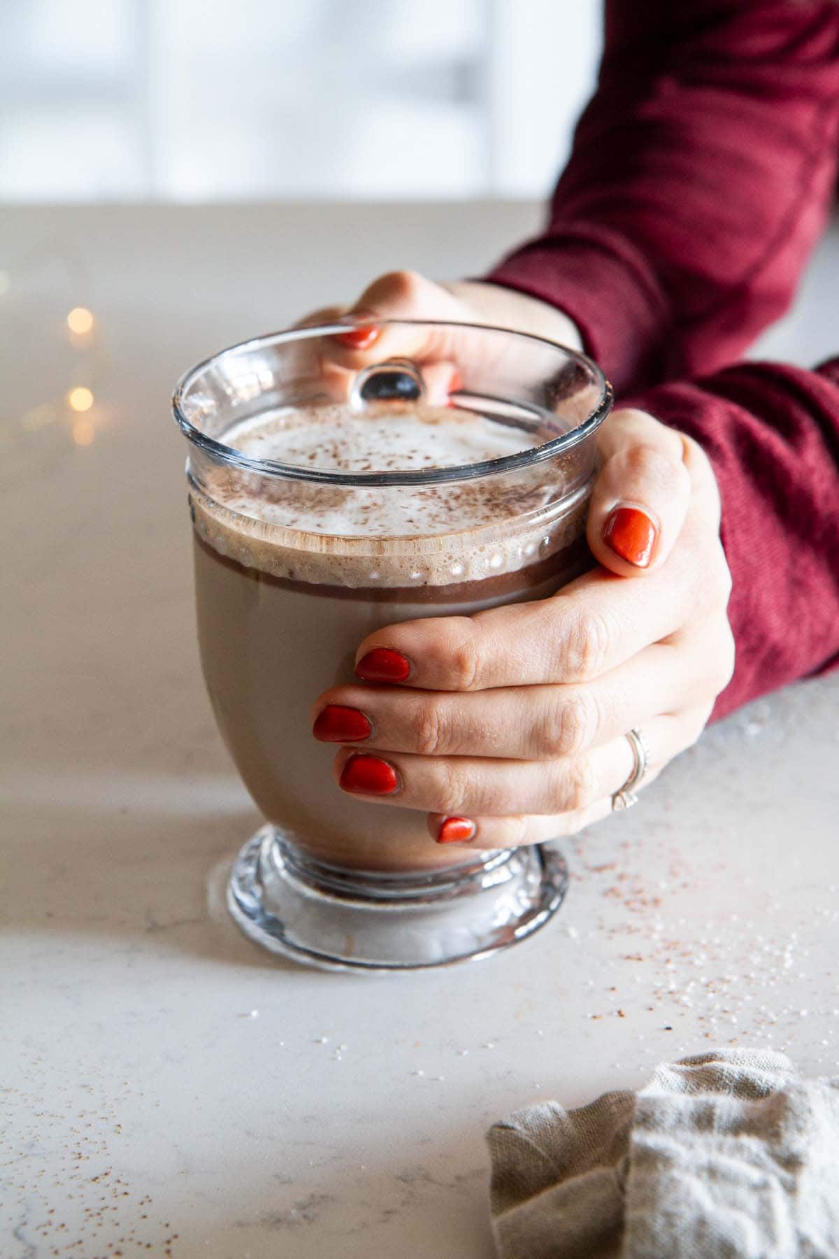 hands holding the chocolate hazelnut latte mug