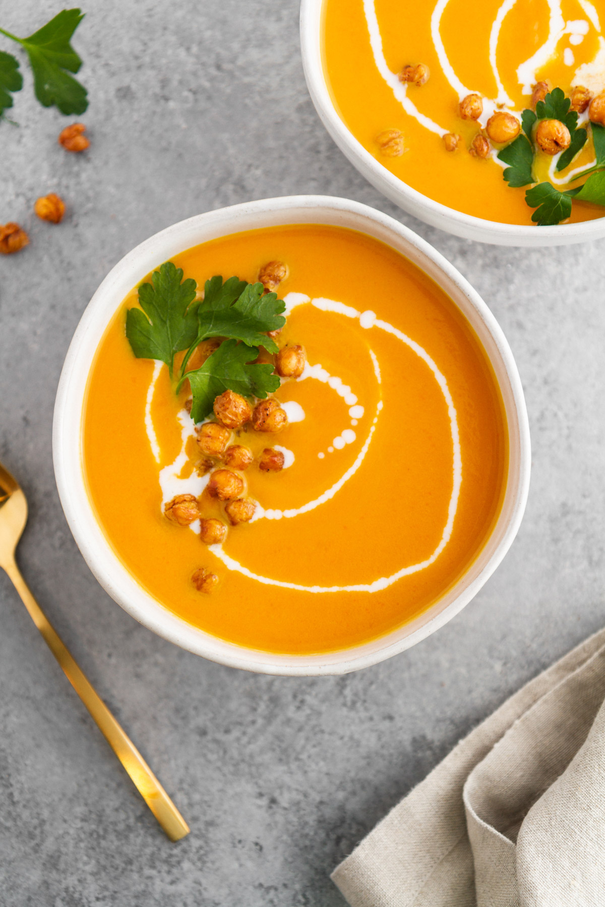 overhead view of carrot ginger coconut soup in a bowl