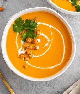 carrot ginger coconut soup in bowl