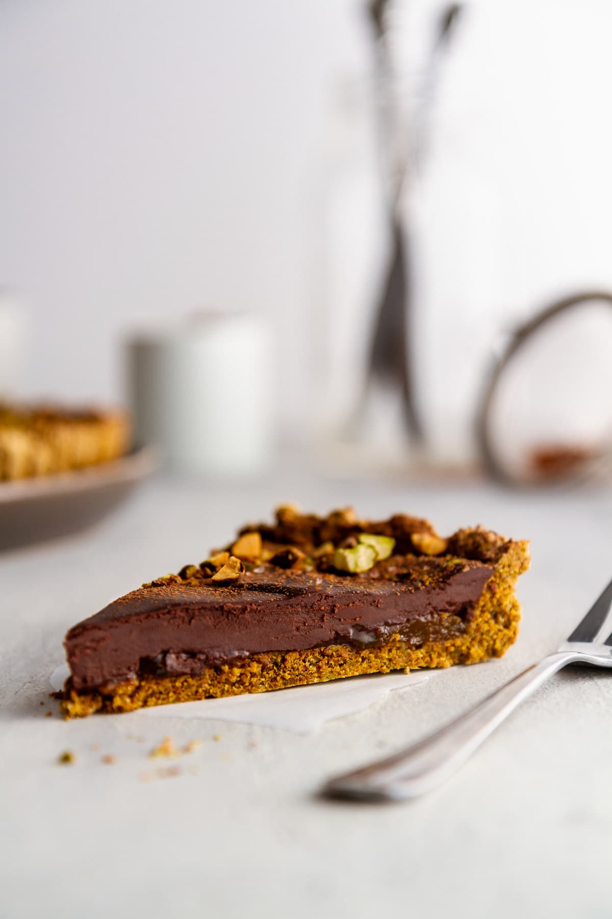 a slice of a chocolate tart on a surface