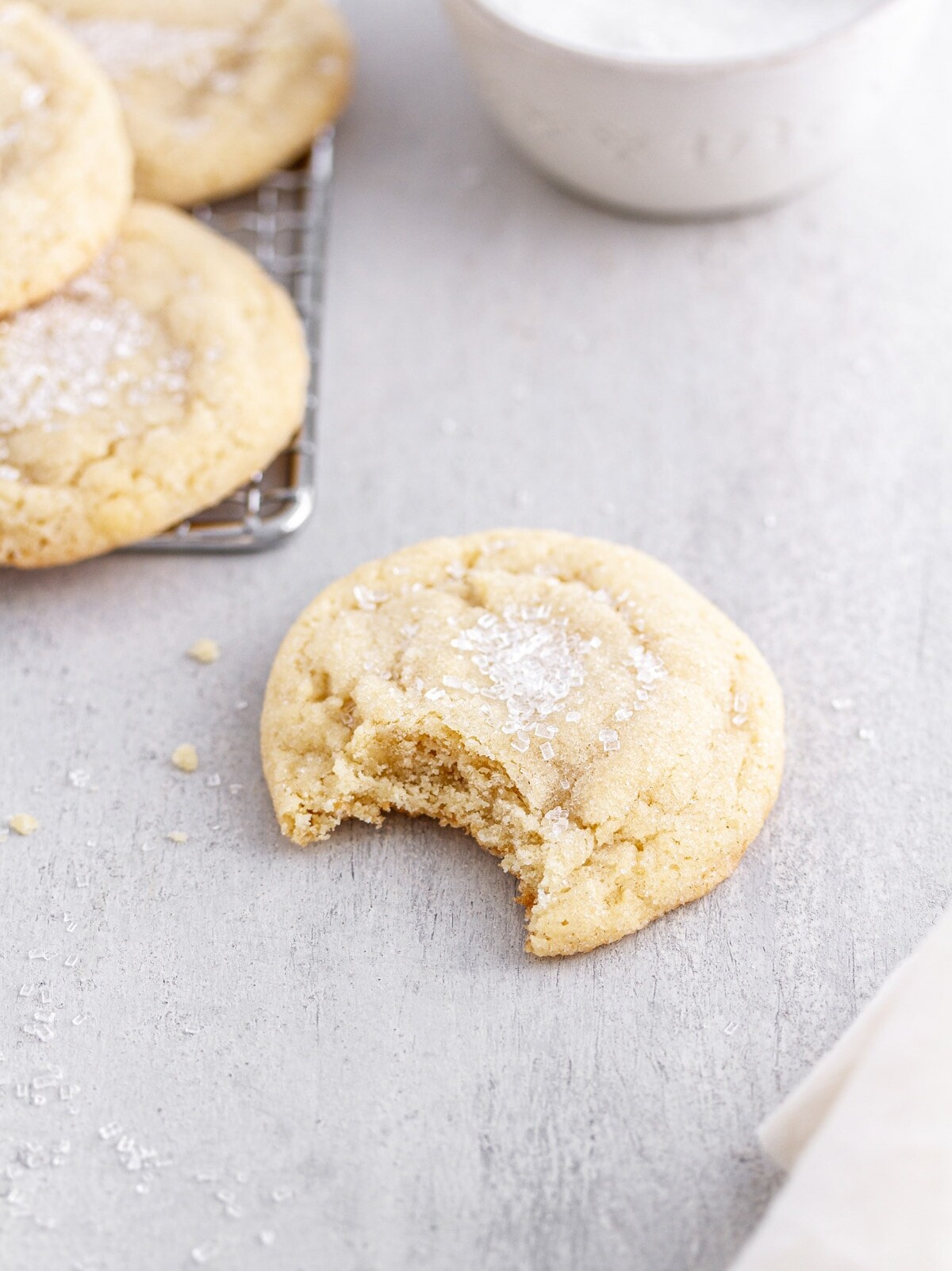 a bite taken out of a chewy sugar cookie