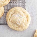 a chewy sugar cookie on a cooling rack.