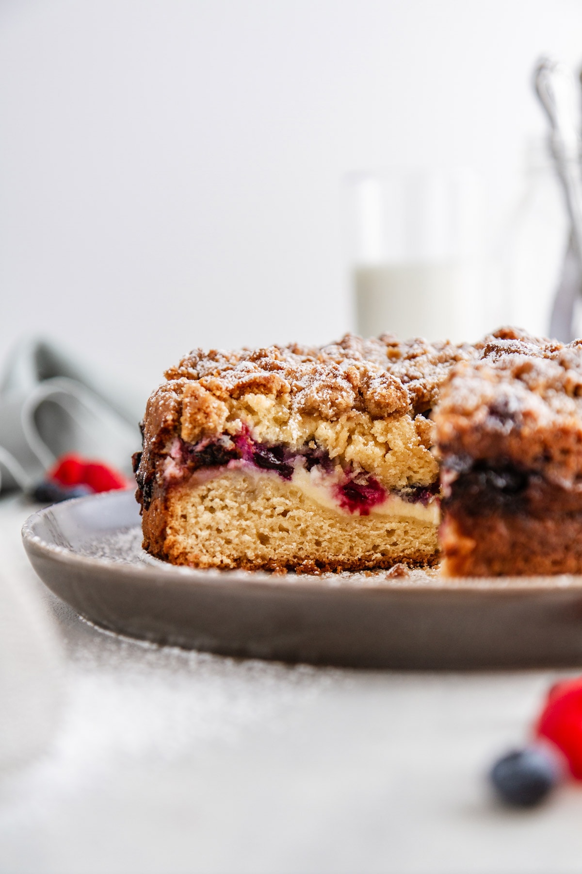 a slice of berry cream cheese coffee cake on a plate