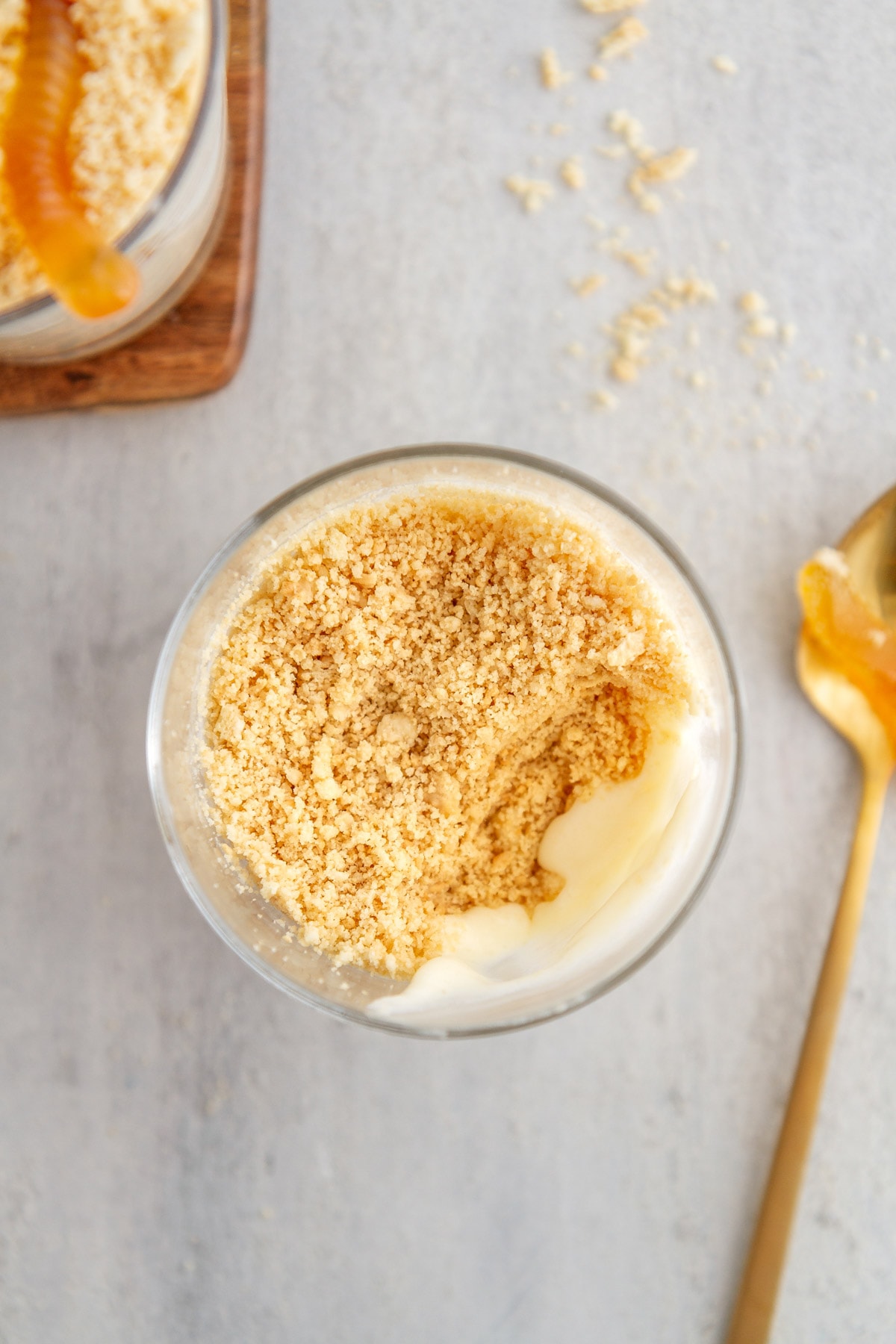 an overhead shot of a golden oreo dirt cup with a spoonful taken out of it