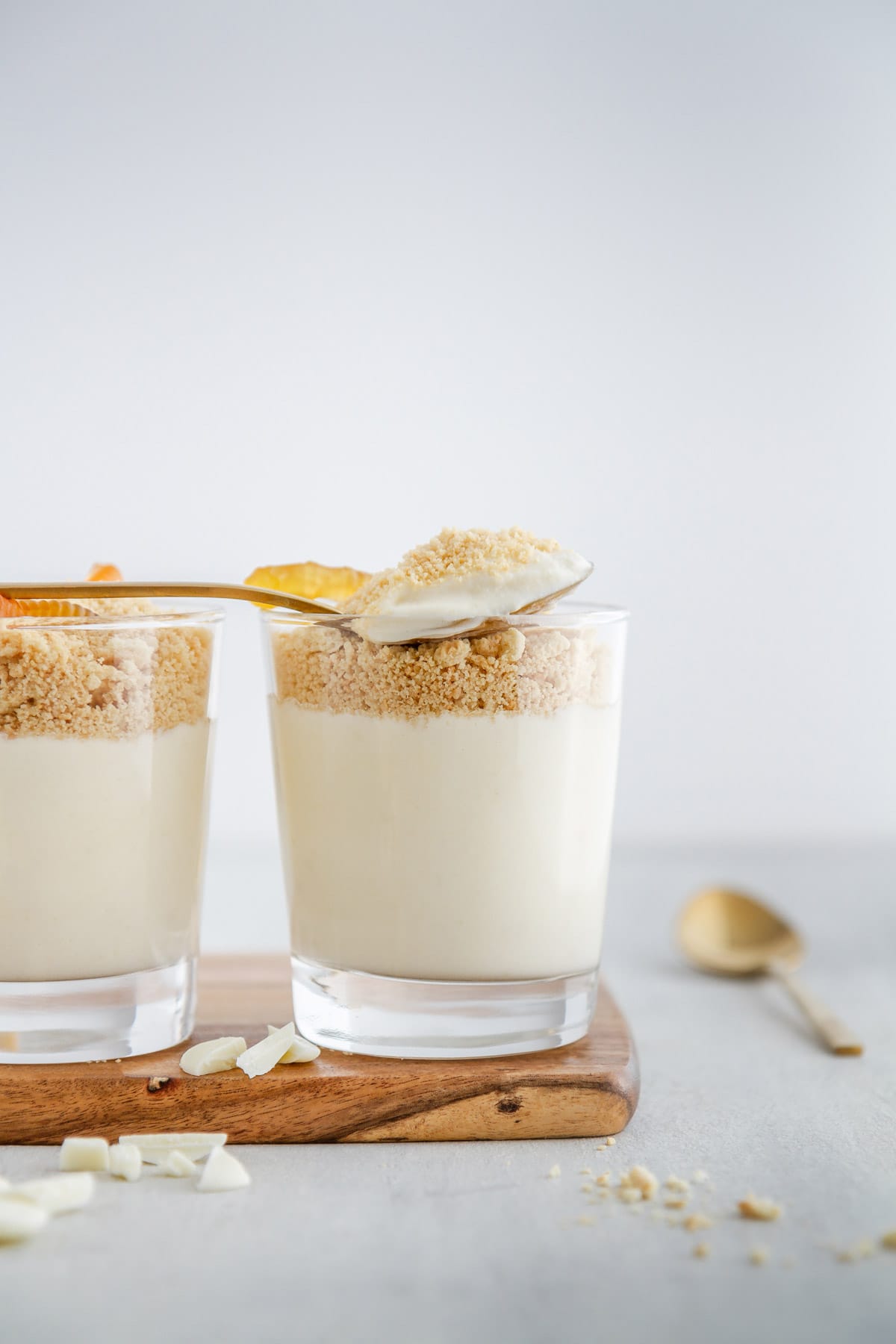 a spoonful of golden oreo dirt cup on top of a glass