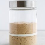 sourdough starter doubled in glass jar.