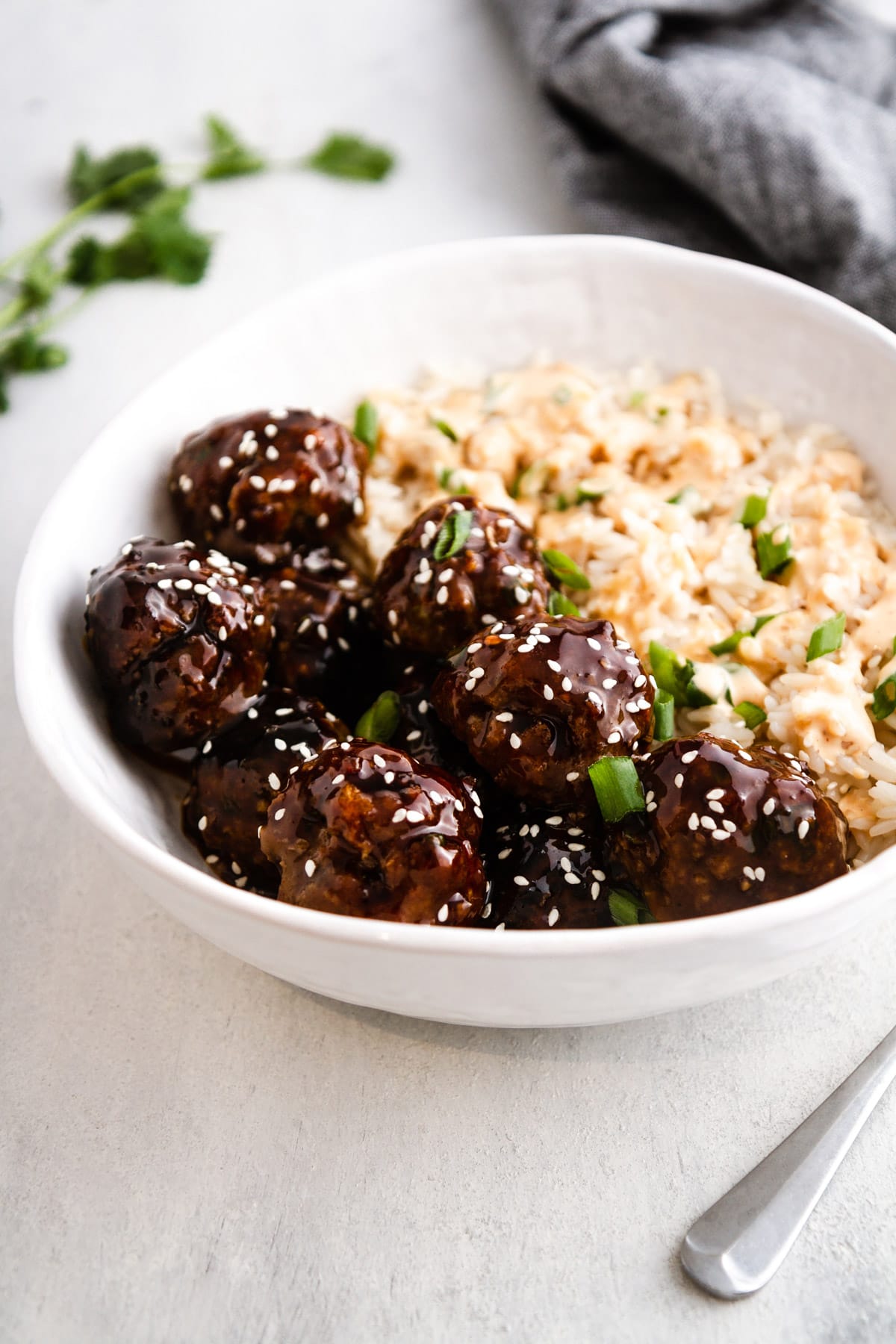 korean bbq meatballs in a bowl with rice