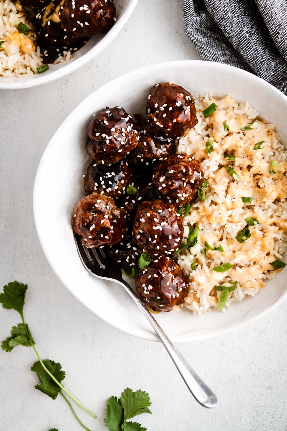 korean bbq meatballs in a bowl with rice