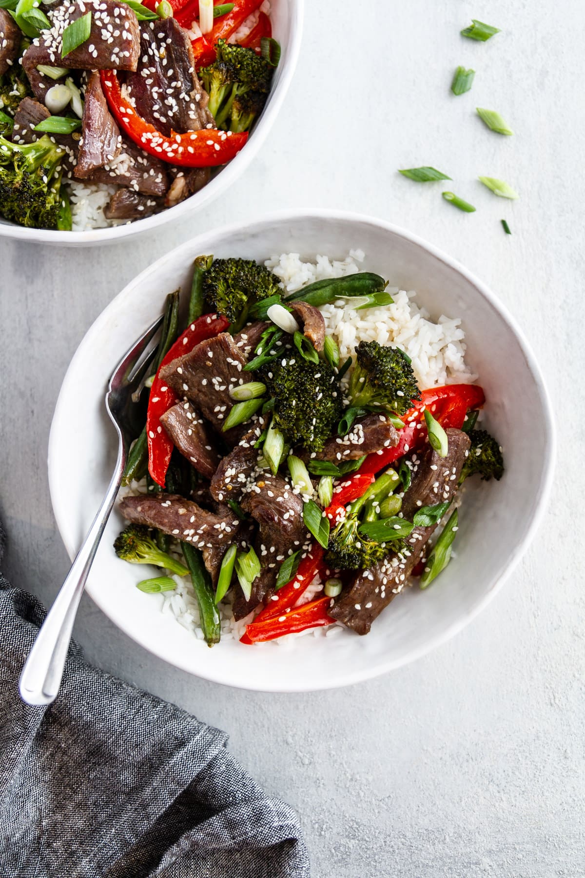 bowls of sheet pan mongolian beef on a surface