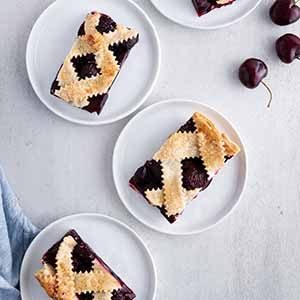 cherry pie bars on plates.