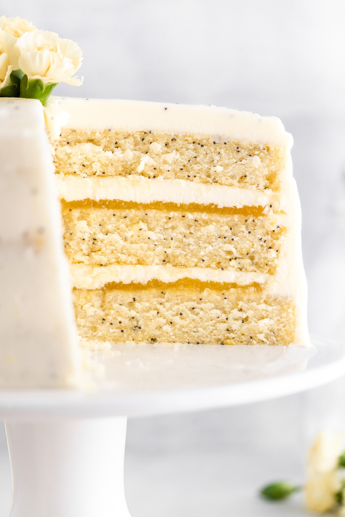 a close up shot of lemon poppy seed cake