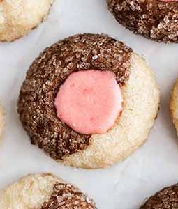 Neapolitan thumbprint cookies on parchment paper