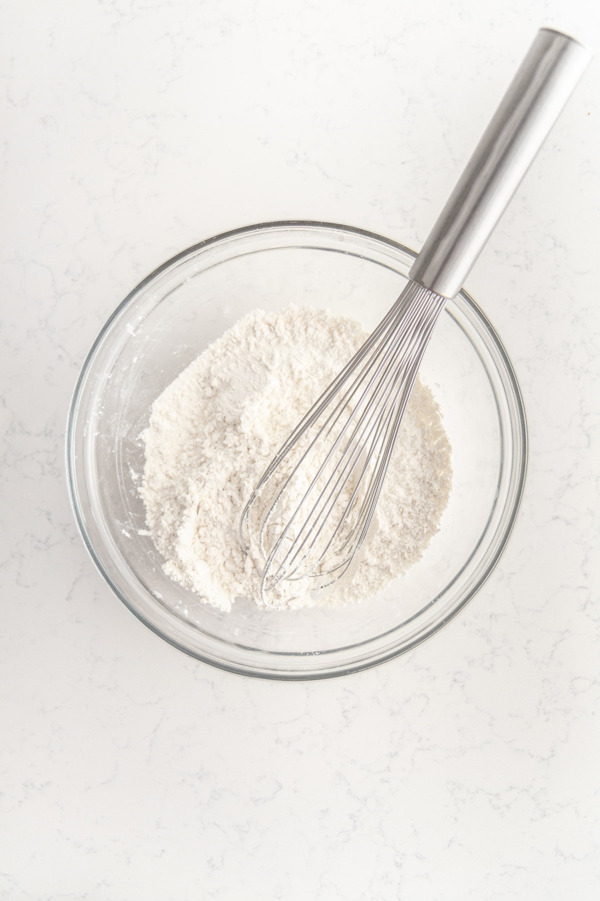 flour mixture in a bowl with a whisk