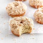 maple donuts on parchment paper.