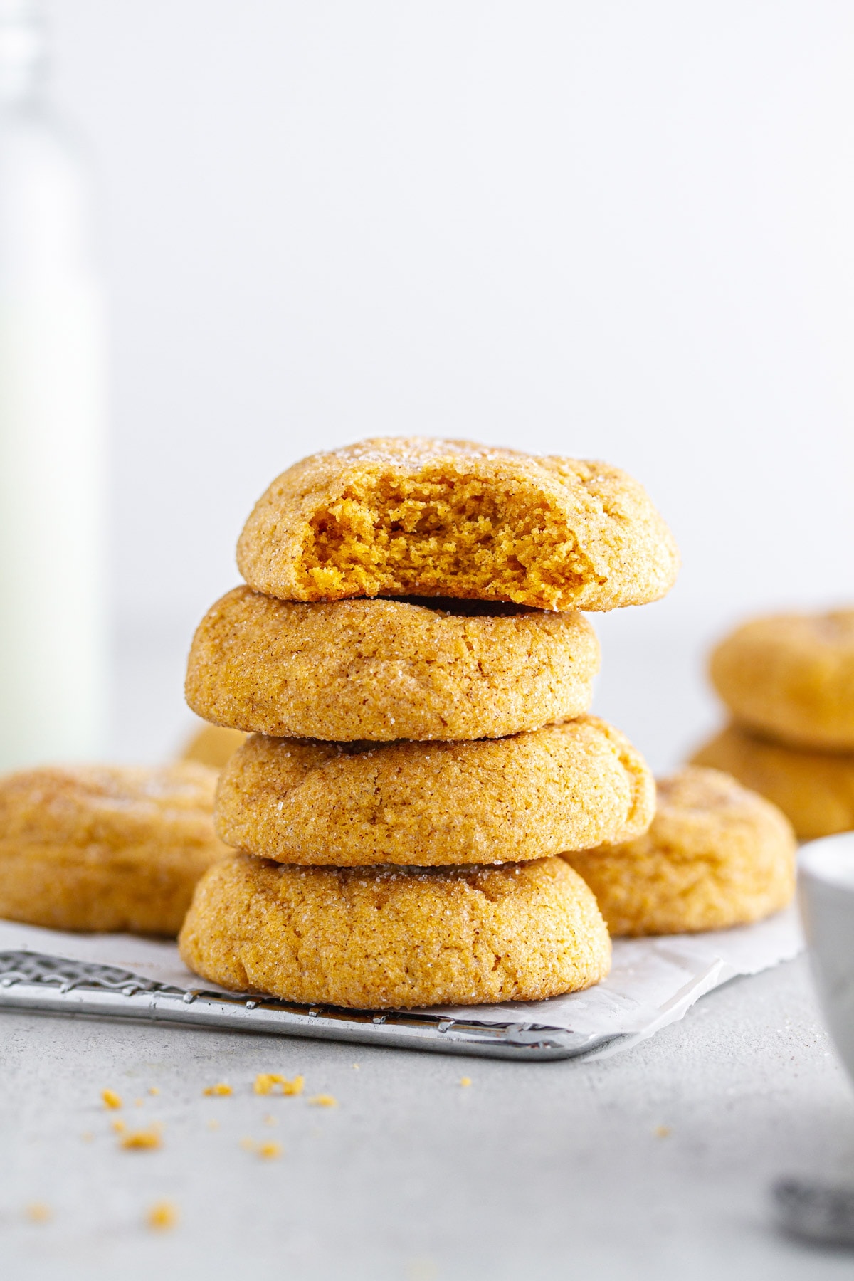 stack of pumpkin snickerdoodles on a cooling rack