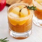 harvest apple ginger smash in a glass on a surface.
