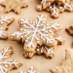 eggnog latte cutout cookies on parchment paper.