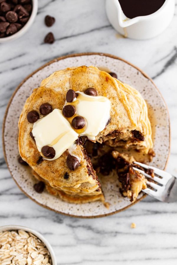 overhead shot of oatmeal chocolate chip cookie pancakes on a plate.