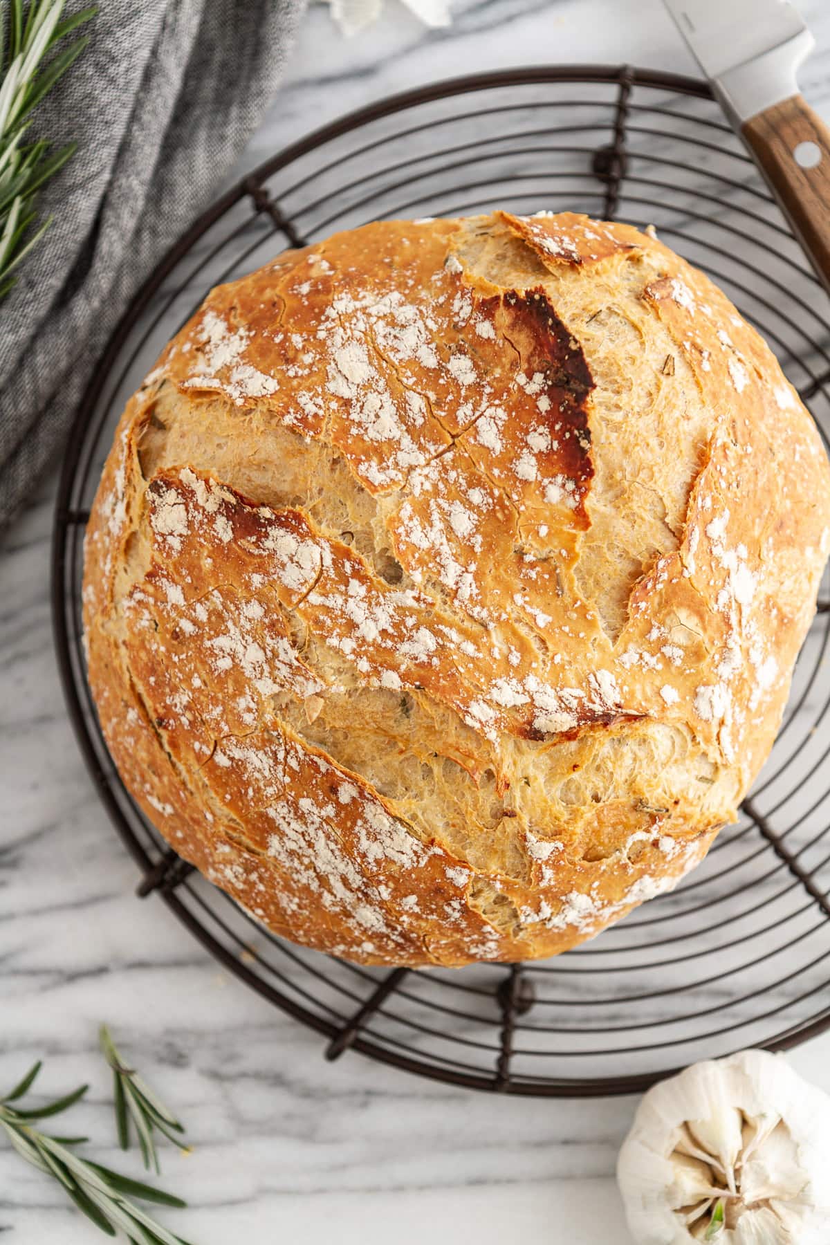 rosemary-garlic no-knead bread on a cooling rack