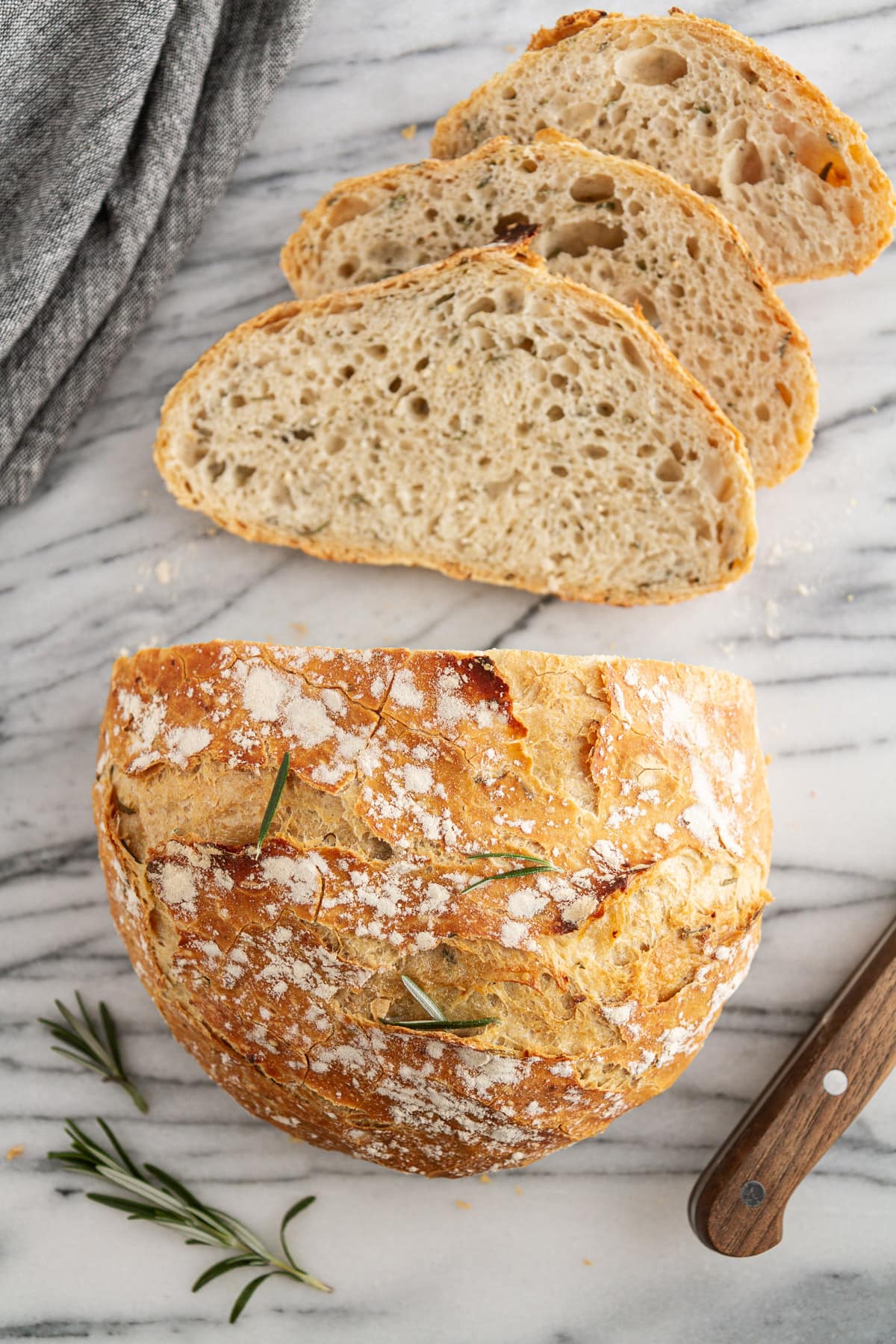 slices of rosemary-garlic no-knead bread on a surface