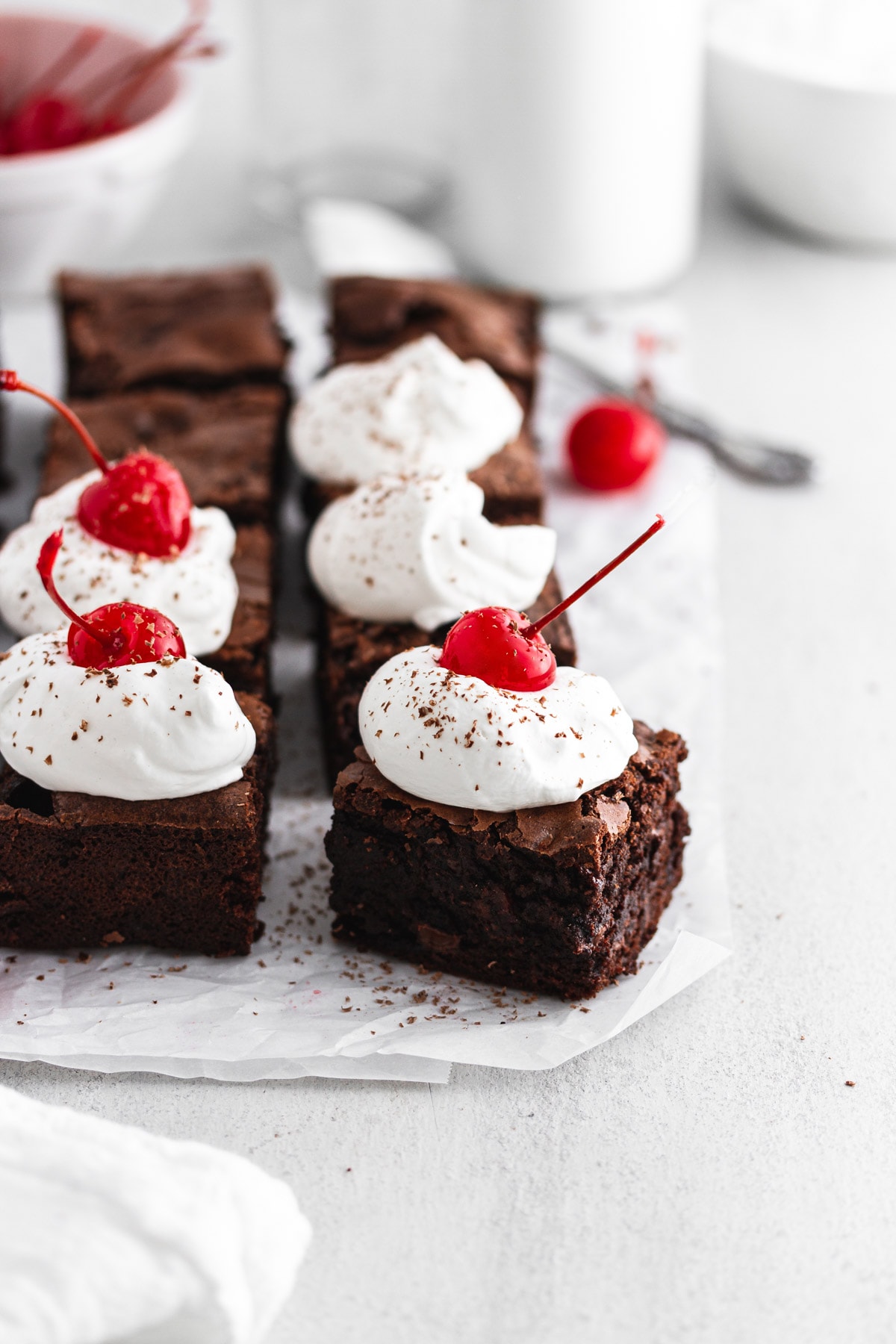black forest cherry brownies on parchment paper