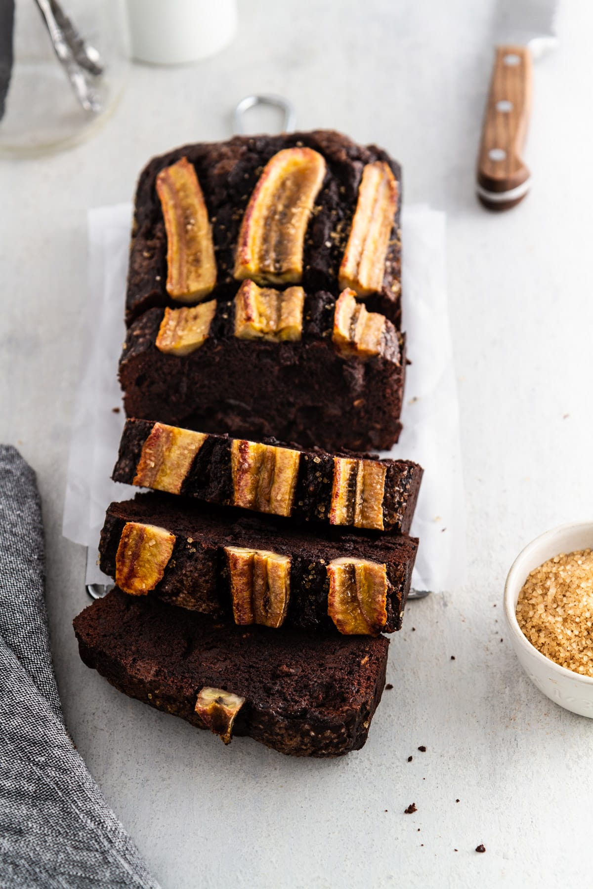 sliced chocolate banana bread on a cooling rack