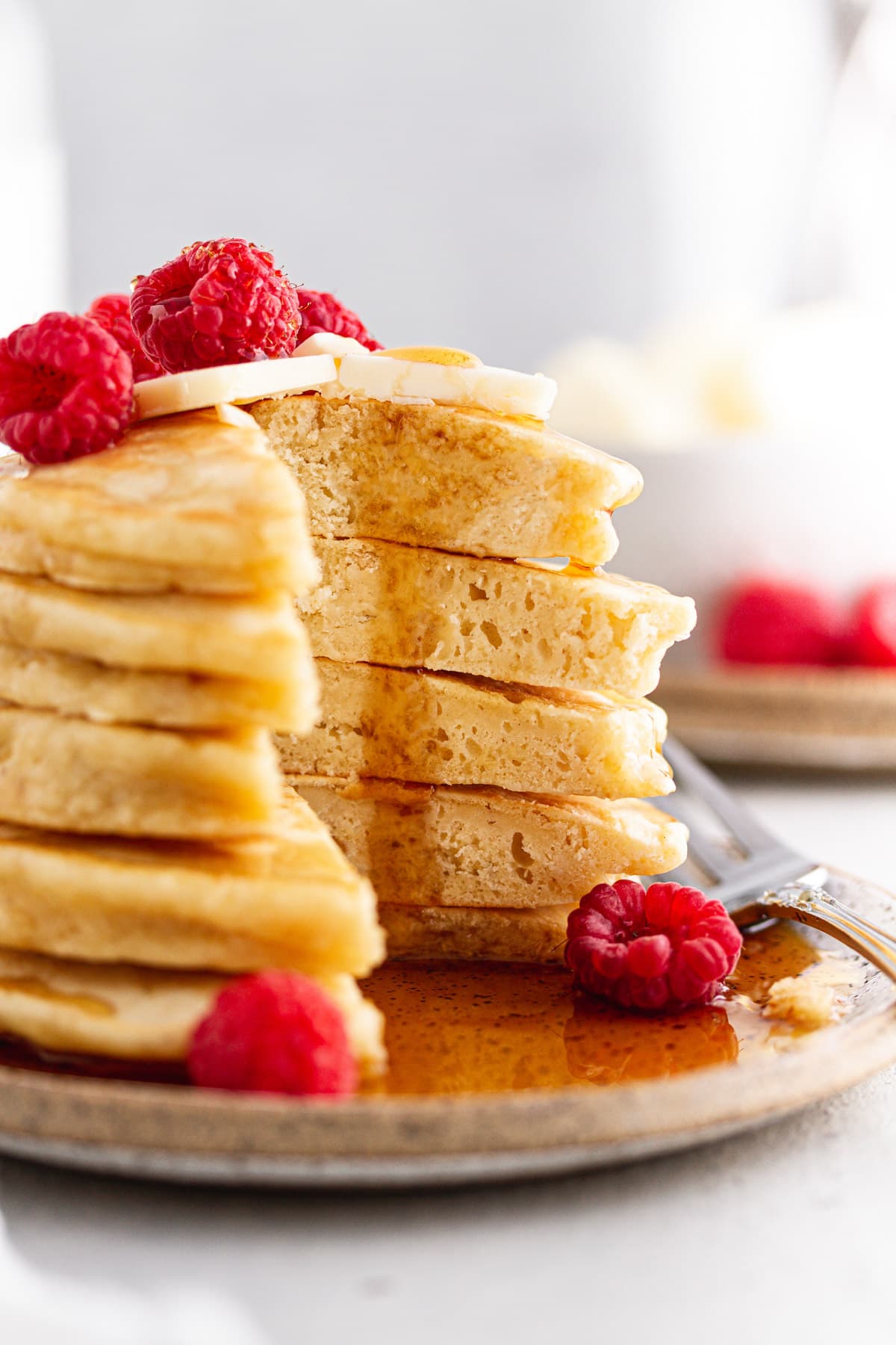 cross-section of sourdough discard pancakes with syrup on top an easy sourdough discard recipes.