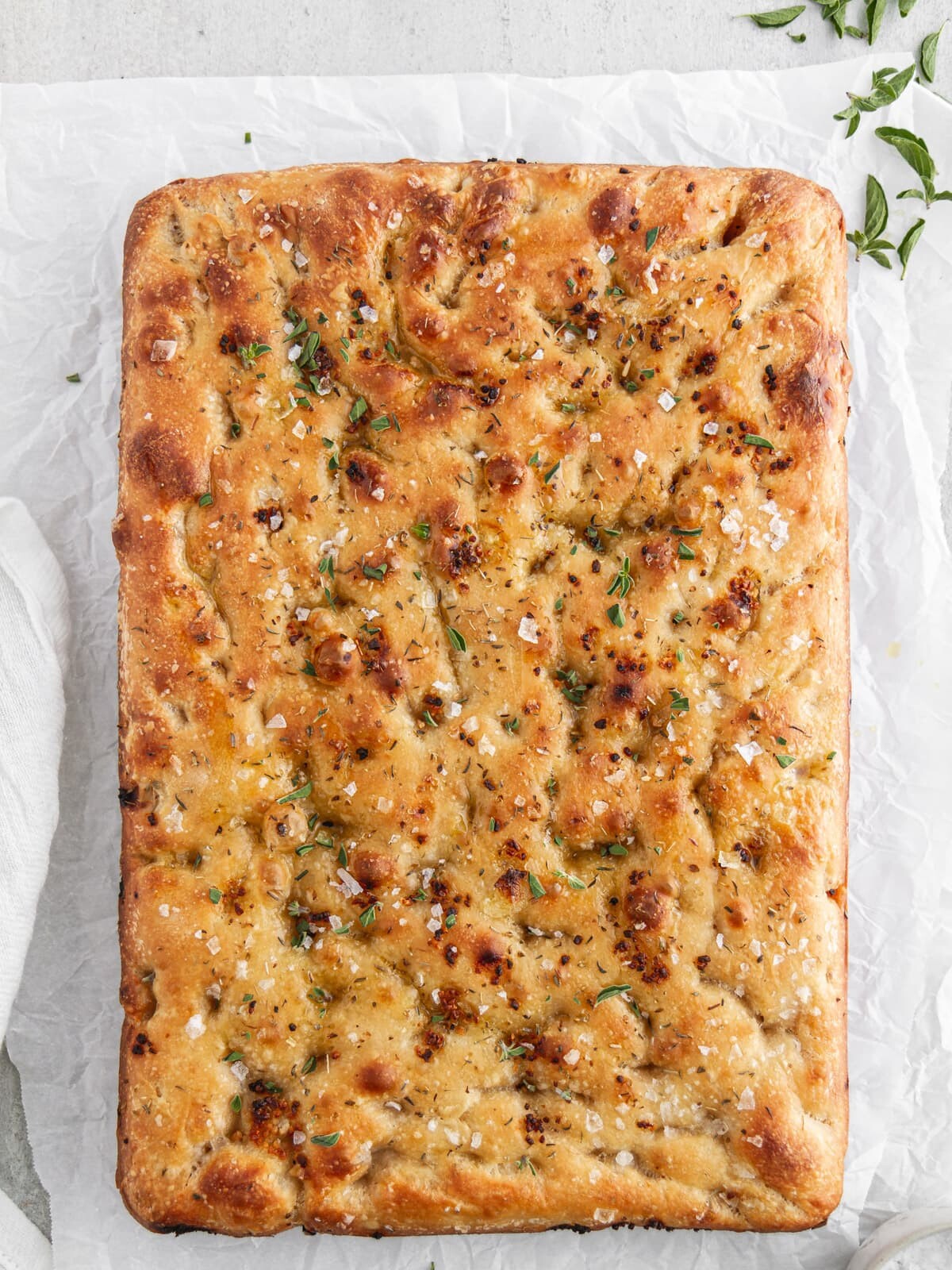 sourdough focaccia on parchment paper.