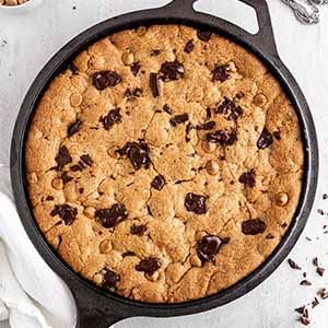 peanut butter chocolate skillet cookie on a surface.